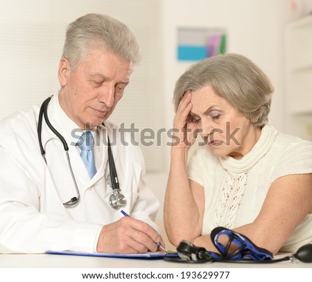 Elderly woman came to the doctor. measuring blood preassure