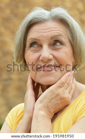 Portrait of a cute old woman outdoors