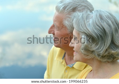 Happy senior couple on a nature background