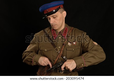 colonel commander with a gun on a dark background