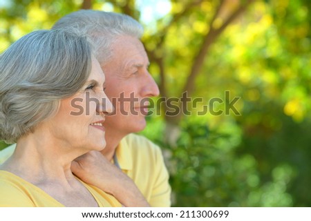 Portrait of nice senior couple outdoor in summer park