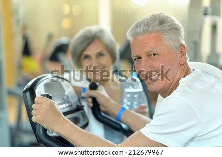Portrait of senior Couple Exercising In gym