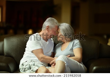 Nice old couple resting in hotel hall