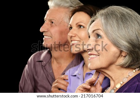Cute family portrait , adult daughter with senior parents
