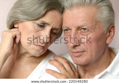Happy older pair on a white background