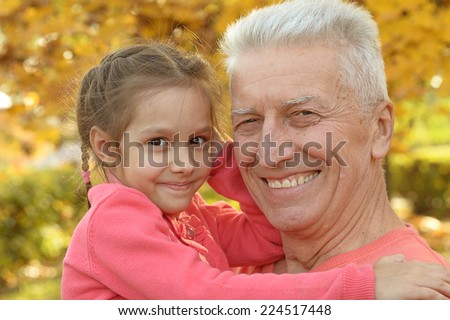 Happy older couple walking in the park
