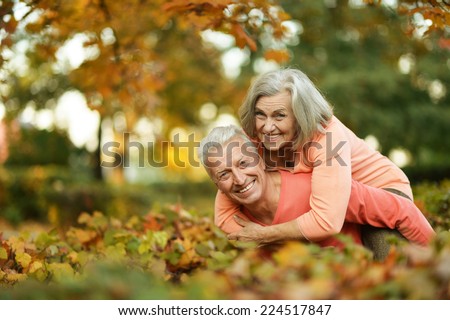 Beautiful caucasian elder  couple in the park in autumn