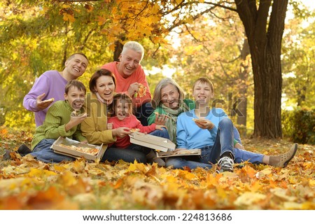 Happy large family picnic in the woods