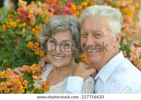 Loving happy elder couple in tropic resort