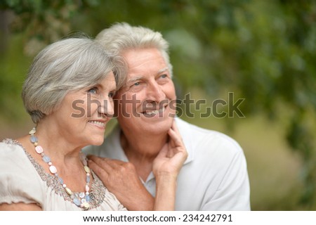 Portrait of  happy elderly couple at nature background