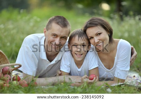 Happy family with a basket of fruits