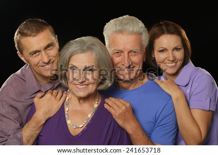 Cute family portrait with senior parents