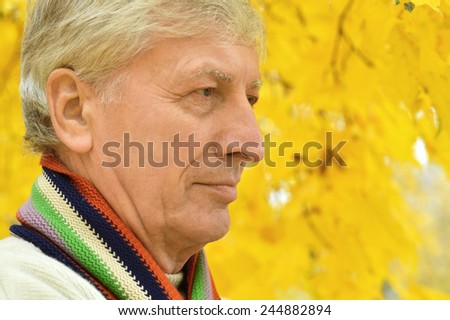 Portrait of senior man thinking about something outdoor