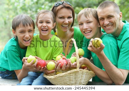 Happy Family having picnic in summer park