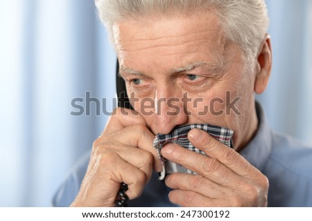 Sick old man with tooth pain call a doctor