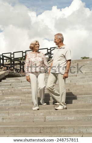 Beautiful elderly couple went for a walk around the city together