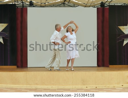 Happy Mature couple in love dancing