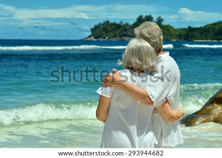 Happy elderly couple rest at tropical resort