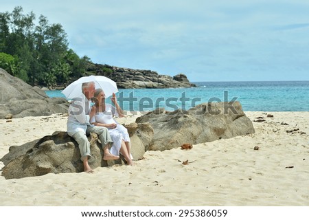Beautiful happy elderly couple rest at tropical resort