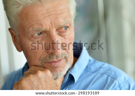 Portrait of Sad senior man at home