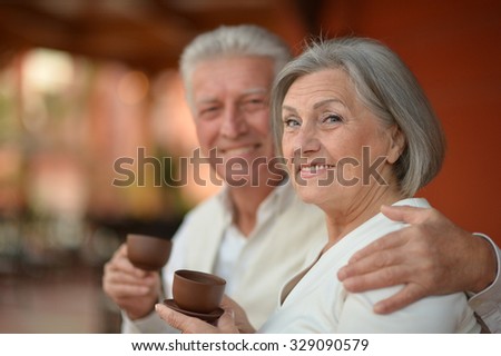 Senior couple drinking coffee  at the table