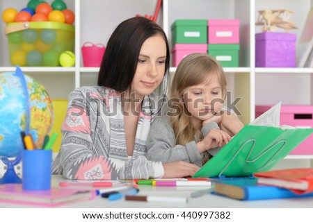 beautiful teacher and little girl
