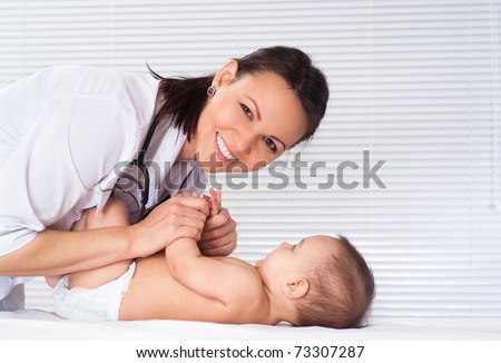 beautiful doctor and baby on a white background