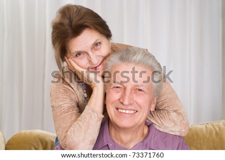 happy elderly couple together on a white