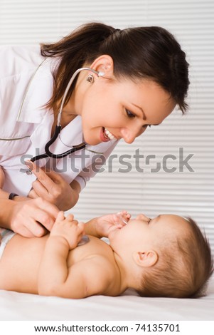 beautiful doctor and baby on a white background