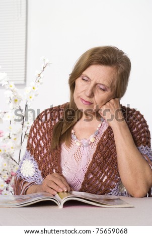 beautiful elderly woman in brown clothes