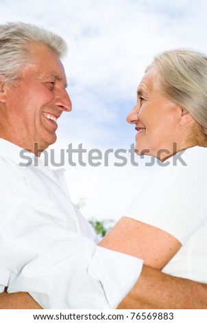 nice elderly couple together in a summer park
