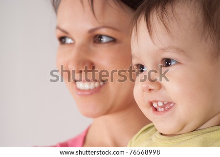 happy mom with her daughter on white