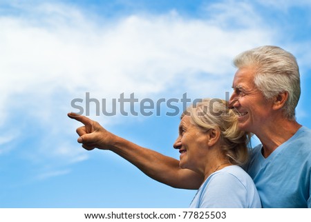 happy elderly couple on a sky background