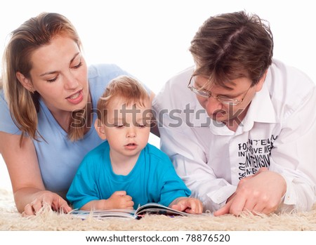 cute family of a three  lying on a carpet