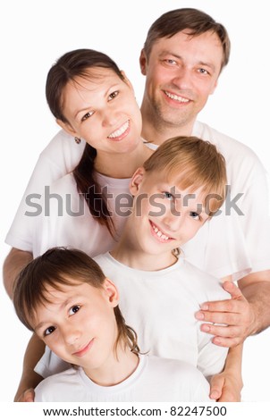 pretty family in white clothes on a white