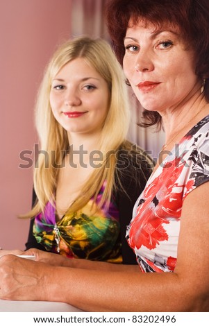 portrait of a mom and her adult daughter