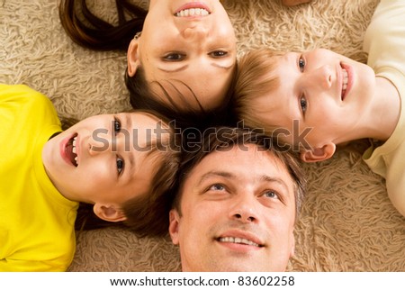 nice family of a four on a carpet