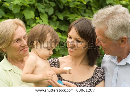 old parents with cute daughter at nature