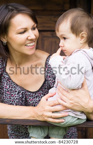 portrait of a nice mom and child outdoors