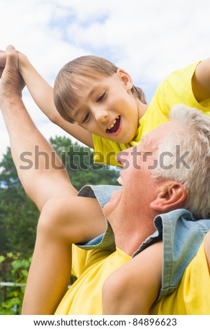 portrait of a nice old man with child