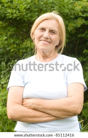 portrait of a cute old woman at nature