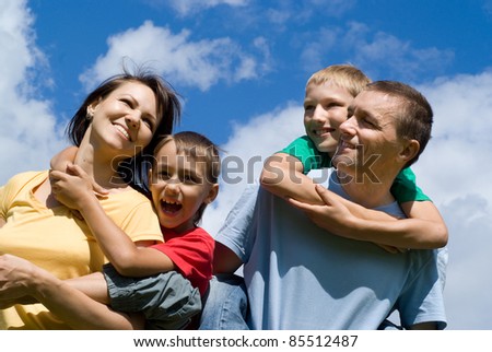portrait of a cute family on a sky background