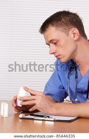 portrait of a cute young doctor at table