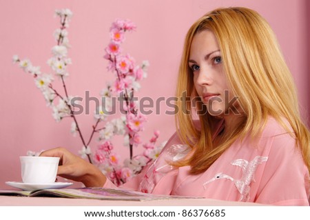 portrait of a nice girl in pink at table