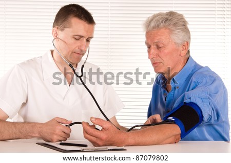 portrait of a cute doctor with aged patient