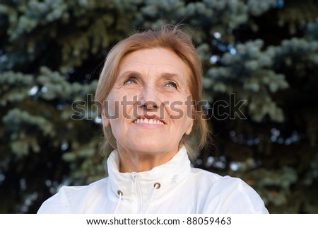 portrait of an old woman at pine