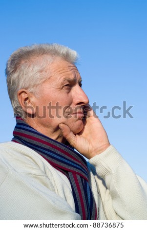 portrait of a pretty elderly man and sky