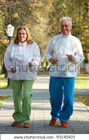 cute active old people in a park
