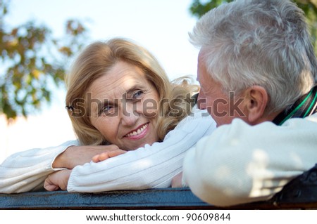 portrait of a pretty elderly couple at nature