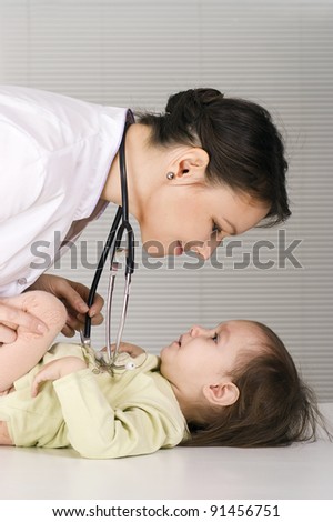 cute doctor with little girl on white